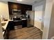 Well-equipped kitchen with stainless steel appliances and dark wood cabinets at 14501 Grove Resort Ave # 1637, Winter Garden, FL 34787