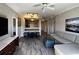 Bright living room with hardwood floors, modern furniture, and an open-concept design at 14501 Grove Resort Ave # 1637, Winter Garden, FL 34787