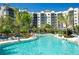 Resort-style pool with plenty of lounge chairs at 14501 Grove Resort Ave # 1637, Winter Garden, FL 34787