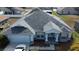 Aerial view showcases home's roof, and manicured front yard at 959 Nancy Ct, Kissimmee, FL 34759