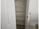 Walk-in pantry with wire shelving, accessible through white door at 959 Nancy Ct, Kissimmee, FL 34759