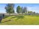 Fenced-in backyard with grassy lawn and trees at 2755 Monticello Way, Kissimmee, FL 34741