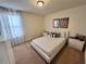 Charming bedroom with a queen-size bed and light decor at 2755 Monticello Way, Kissimmee, FL 34741