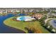 Community pool with clubhouse and lake view at 2755 Monticello Way, Kissimmee, FL 34741