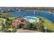 Community pool and clubhouse near lake at 2755 Monticello Way, Kissimmee, FL 34741