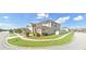 A charming two-story home with lush landscaping in a suburban neighborhood at 2585 Needlepoint St, Kissimmee, FL 34741