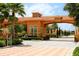 Gated community entrance with attractive archway and landscaping at 301 Las Fuentes Dr, Kissimmee, FL 34746