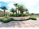 Landscaped median with community name signage at 301 Las Fuentes Dr, Kissimmee, FL 34746