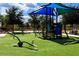 playground with shade structure and play equipment at 301 Las Fuentes Dr, Kissimmee, FL 34746