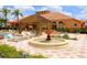 Resort-style pool with fountain, pergola, and lounge chairs at 301 Las Fuentes Dr, Kissimmee, FL 34746