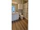 Bathroom featuring tile flooring, white vanity, cabinets, a toilet and a tub with shower and modern shower curtain at 2307 Butterfly Palm Way # 201, Kissimmee, FL 34747