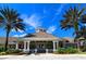 Beautiful community center with lush landscaping, perfect for gatherings and events at 2307 Butterfly Palm Way # 201, Kissimmee, FL 34747