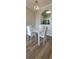 Dining room with a modern table set and a view of the kitchen at 2307 Butterfly Palm Way # 201, Kissimmee, FL 34747