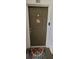 Condo front door, decorated with a welcome sign, and stylish door mat at 2307 Butterfly Palm Way # 201, Kissimmee, FL 34747