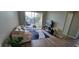 Bright living room featuring a balcony, hardwood floors and stylish furnishings at 2307 Butterfly Palm Way # 201, Kissimmee, FL 34747