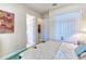 Bedroom with ensuite bathroom and closet featuring neutral walls and carpet at 441 Mayfair Dr, Kissimmee, FL 34759
