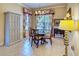Cozy dining room with a round table, chandelier, and a built in cabinet for elegant storage at 441 Mayfair Dr, Kissimmee, FL 34759