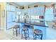 Bright kitchen with an island, black granite countertops, and stainless steel appliances at 441 Mayfair Dr, Kissimmee, FL 34759