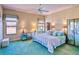 Serene main bedroom with plush carpet, soft lighting, and a view of the outdoors at 441 Mayfair Dr, Kissimmee, FL 34759