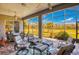 Screened-in patio showcasing comfortable seating and golf course views at 441 Mayfair Dr, Kissimmee, FL 34759