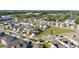 Wide aerial shot of a neighborhood featuring a playground and well-maintained homes at 1134 Forest Gate Cir, Haines City, FL 33844