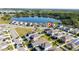 Aerial view of a home in a community near a pond and a playground for outdoor enjoyment at 1134 Forest Gate Cir, Haines City, FL 33844