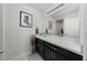 Well-lit bathroom showcasing a long vanity with a marble countertop and modern fixtures at 1134 Forest Gate Cir, Haines City, FL 33844