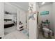 Coastal themed bathroom with a glass-enclosed shower, decorative accents, and ample natural light at 1134 Forest Gate Cir, Haines City, FL 33844