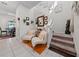 Bright entryway with decor accents and staircase with neutral-toned carpet at 1134 Forest Gate Cir, Haines City, FL 33844