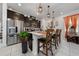 Bright kitchen with stainless steel appliances and breakfast bar seating at 1134 Forest Gate Cir, Haines City, FL 33844