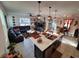 Open concept living area with kitchen island and comfortable seating arrangement at 1134 Forest Gate Cir, Haines City, FL 33844
