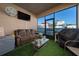 Cozy screened patio with comfortable seating, perfect for relaxation and entertainment at 1134 Forest Gate Cir, Haines City, FL 33844