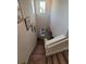 Bright staircase with carpeted steps and modern white railing, illuminated by natural light from windows at 1134 Forest Gate Cir, Haines City, FL 33844