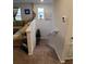 Cozy staircase with plush carpeting, leading to the living area at 1134 Forest Gate Cir, Haines City, FL 33844