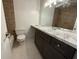 Tiled bathroom featuring a dark vanity with a marble countertop and a tiled shower/tub at 824 Park Lake Pl # 824, Maitland, FL 32751