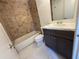 Tiled bathroom featuring a dark vanity with a marble countertop and a tiled shower/tub combo at 824 Park Lake Pl # 824, Maitland, FL 32751