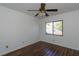 This simple bedroom offers a ceiling fan and hardwood floors, along with natural light at 824 Park Lake Pl # 824, Maitland, FL 32751