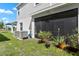 Backyard with screened patio and AC units at 1330 Blazing Star Ln, Davenport, FL 33837