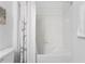 Bathroom with a shower/tub combo and white tile at 1330 Blazing Star Ln, Davenport, FL 33837