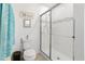 Clean bathroom with a walk-in shower and tile flooring at 1330 Blazing Star Ln, Davenport, FL 33837