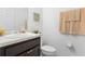 Clean bathroom with single sink vanity and toilet at 1330 Blazing Star Ln, Davenport, FL 33837