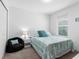 Bedroom with a queen bed and a beanbag chair at 1330 Blazing Star Ln, Davenport, FL 33837