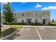 Two-story townhome with gray siding, landscaping, and a paved driveway at 1330 Blazing Star Ln, Davenport, FL 33837