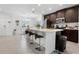 Modern kitchen with dark cabinets, stainless steel appliances, and an island at 1330 Blazing Star Ln, Davenport, FL 33837