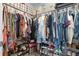 Large walk-in closet with ample hanging space and shelving at 1330 Blazing Star Ln, Davenport, FL 33837