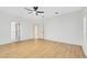 Spacious bedroom with light wood floors, ceiling fan, and neutral walls for a serene retreat at 840 Coach Lamp Ct, Sanford, FL 32771