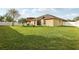 Large, grassy backyard with palm tree, and a white fence line at 2703 Gullane Ct, Kissimmee, FL 34746