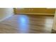 Bedroom with hardwood floors, baseboards, and yellow walls at 2703 Gullane Ct, Kissimmee, FL 34746