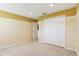 Bedroom with tan walls, carpet, and a closet at 2703 Gullane Ct, Kissimmee, FL 34746