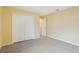 Bedroom featuring carpet, closet, and a door leading to another room at 2703 Gullane Ct, Kissimmee, FL 34746